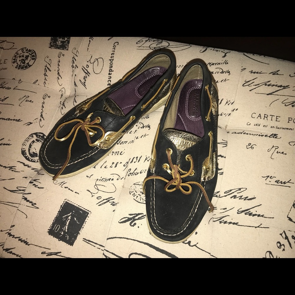 Black and gold leather sperry loafers
